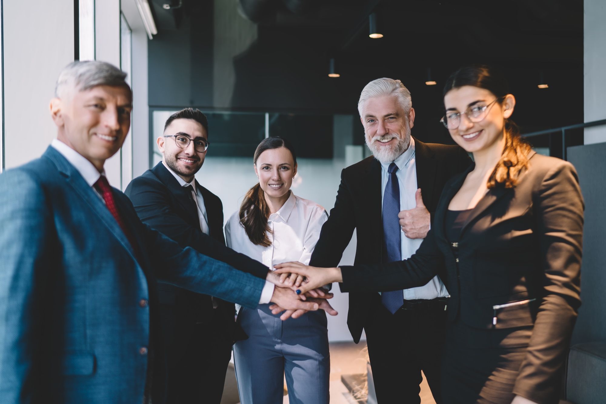 group-of-diverse-colleagues-standing-together-in web.jpg
