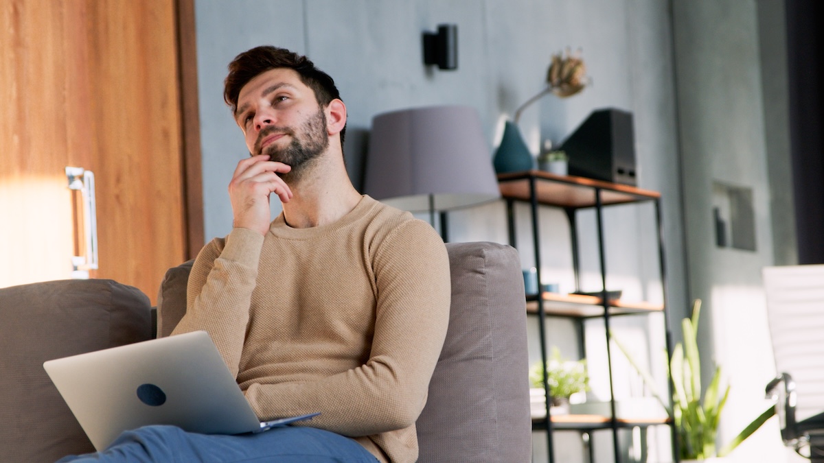 man-relaxing-with-laptop-on-couch-thinking-2026-03-09-03-45-44-utc copy.jpg
